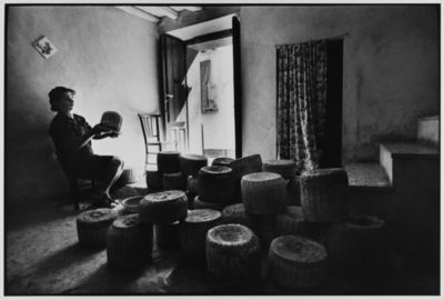 Woman sells cheese from her home, Castelbuono, Sicily, Italy, 1974 by Leonard Freed