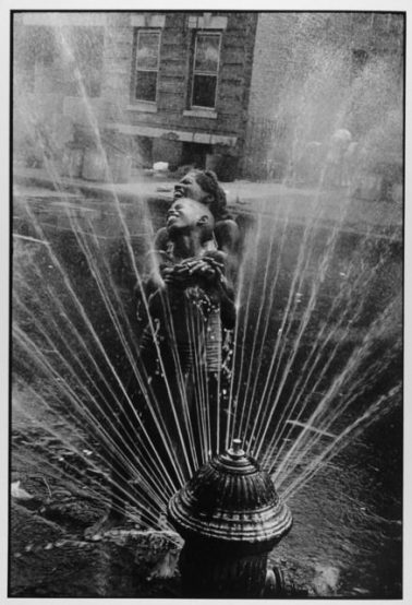 Fire Hydrant Fun, Harlem, NYC, 1963 by Leonard Freed