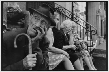 Man on stoop with cane NYC, 1972 by Leonard Freed