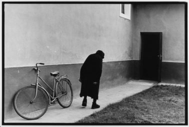 Old Woman and Bicycle Hungary, 1984 by Leonard Freed