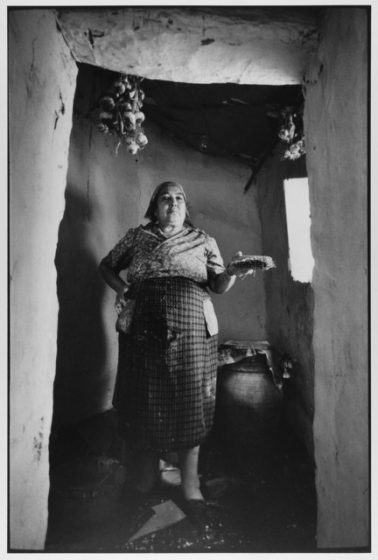 Village Woman painting her home white, Madonie Mountains, Sicily, Italy, 1974 by Leonard Freed