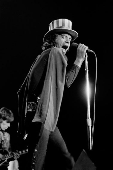 Mick Jagger sings at the Oakland Coliseum Arena, November 1969 by Baron Wolman