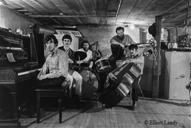 The Band in the basement of, Rick Danko’s Zena Rd. Home, Woodstock, 1969 by Elliott Landy