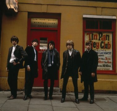 The Rolling Stones standing outside