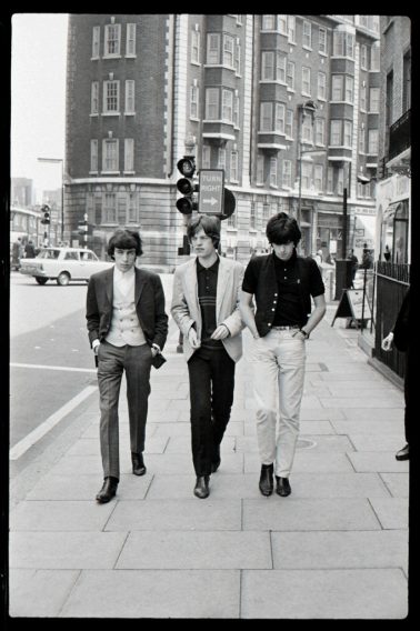 The Rolling Stones walking on the street