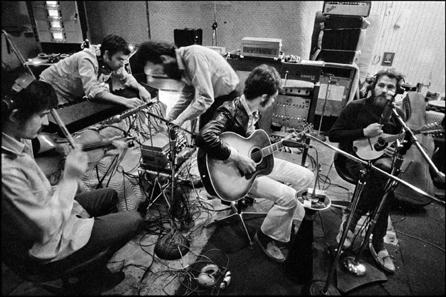 Getting ready for a take while recording The Band album, the pool-house studio. West Hollywood, CA, ’69